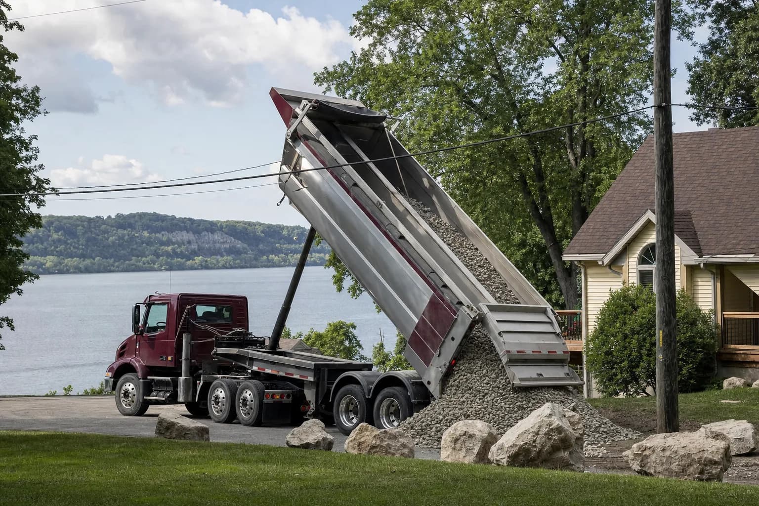 Dump truck delivering gravel